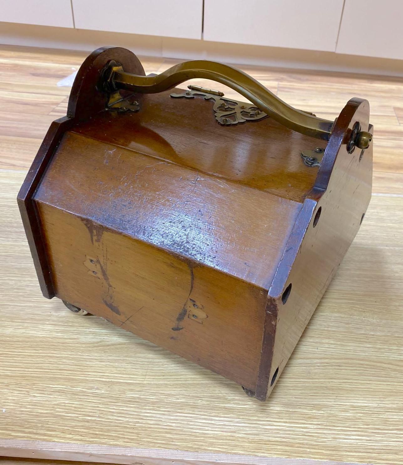 A Gothic revival walnut and brass mounted coal box on ceramic casters, 35cm wide